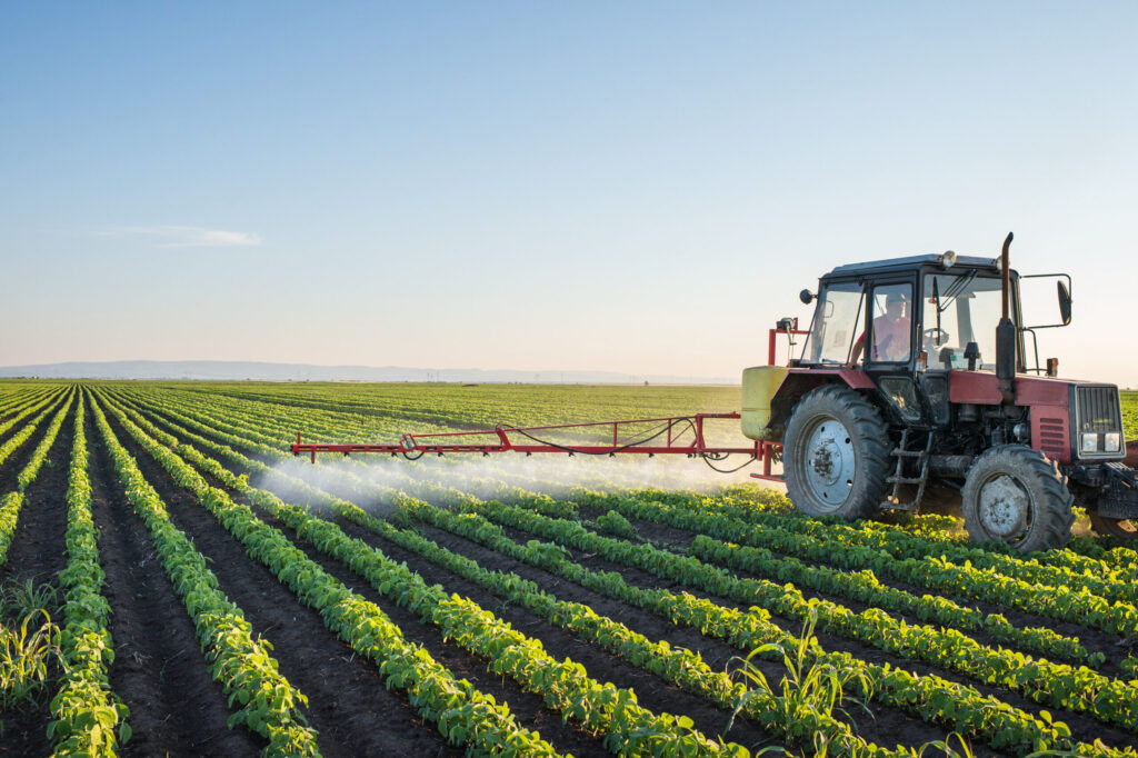 Tractor,Spraying,Soybean,Field,At,Spring